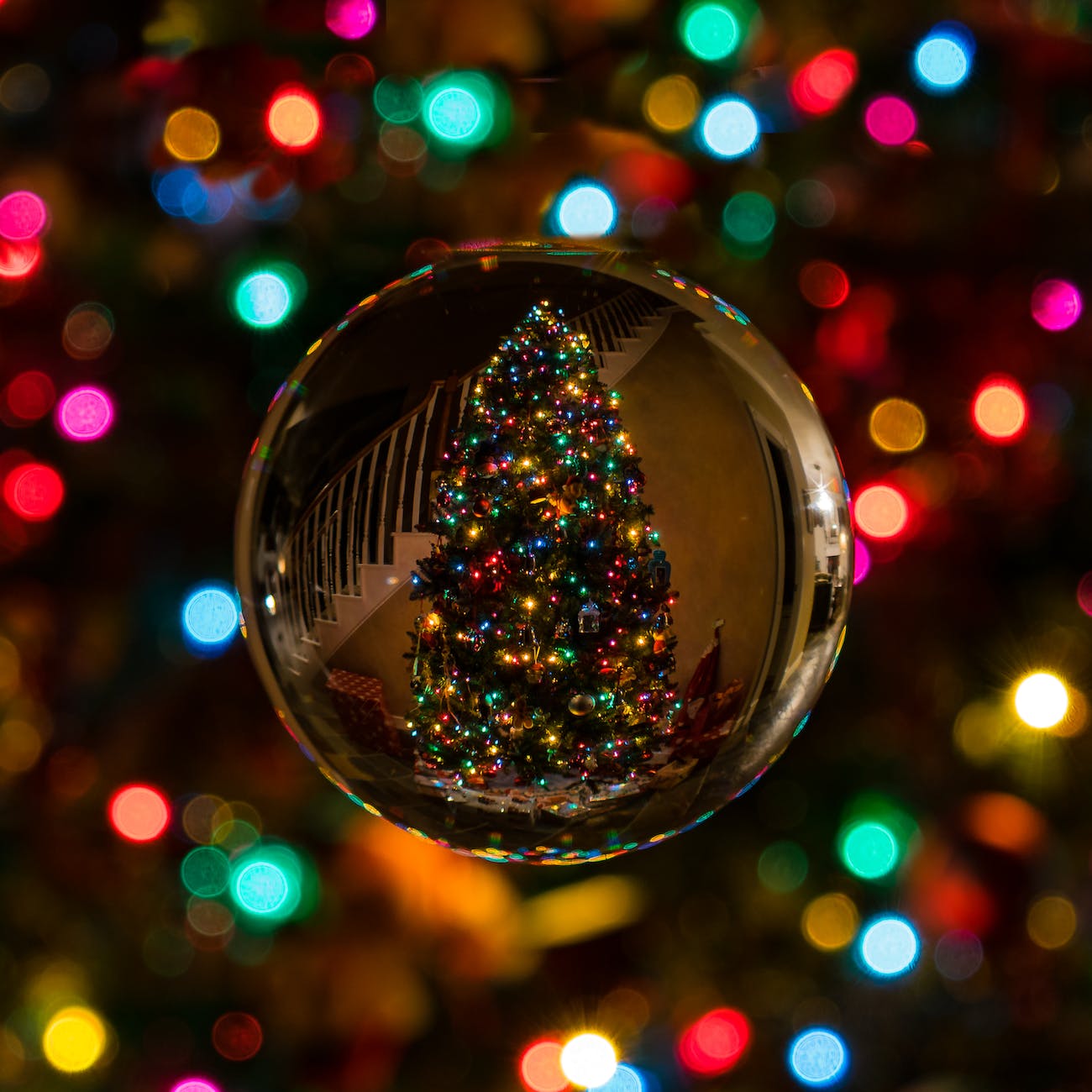 glass bauble reflecting christmas tree